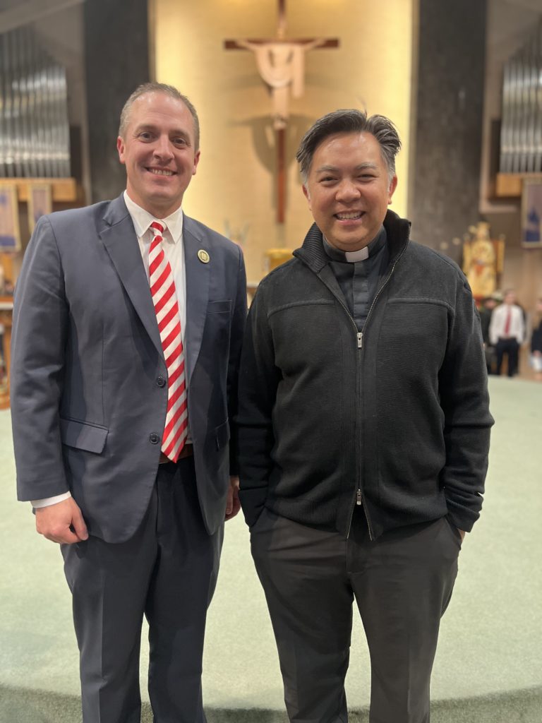 President Shad Hanis and Father Tom